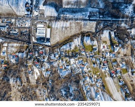 Aerial top down view of a typical Eastern European town in the snow