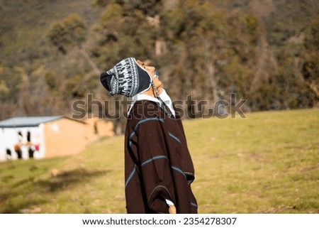 A photo of a farmer using a smartphone during field advertising,horse,farmer,lifestyle,