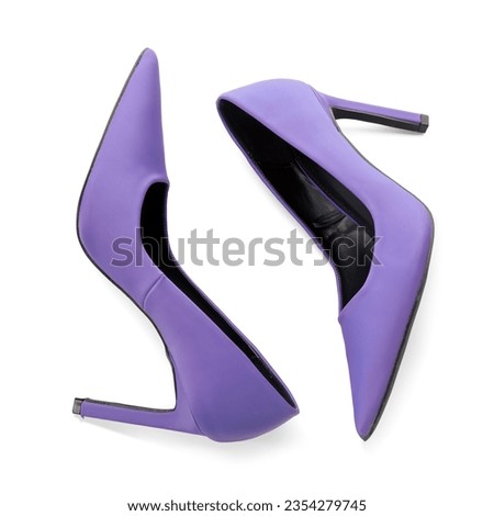 Stylish purple high heels on white background Royalty-Free Stock Photo #2354279745