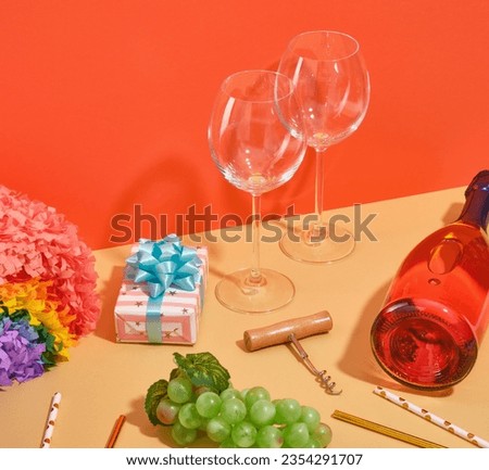 Image of cheerful holiday. Bottle of wine, ripe green grapes and glasses for drinking.