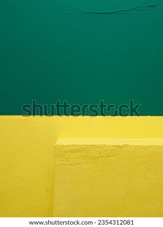 Abstract background consisting of dark green and yellow plates.