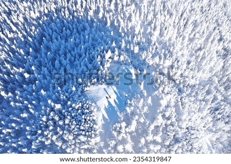 A hike up a mountain in winter in the Canadian province of Quebec, known for its "snow ghosts". The view is taken by a drone Royalty-Free Stock Photo #2354319847