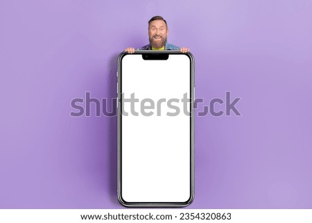 Full body photo of attractive grandpa hide behind big smartphone eshopping dressed stylish denim look isolated on yellow color background