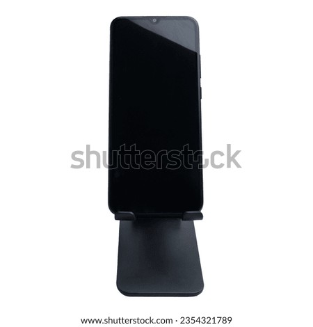 Smartphone on stand holder isolated on white background