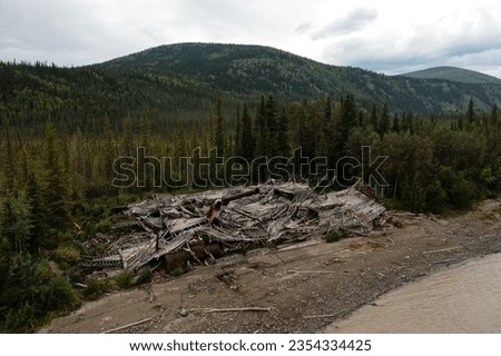 Aerial view of the Paddlewheel Graveyard showing 3 abandoned riverboats near Dawson City  Royalty-Free Stock Photo #2354334425