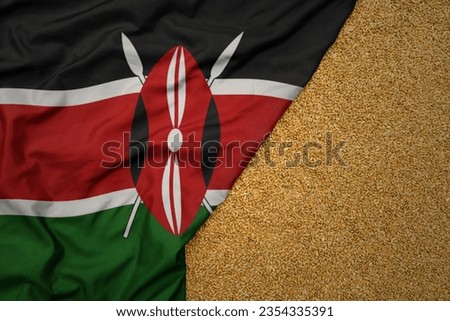 wheat grain on the waving colorful big national flag of kenya .macro shot.