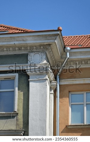 a fragment of a historical building with a wide cornice
