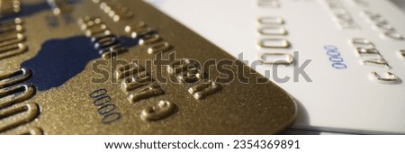 Banking plastic gold and platinum credit card, close-up. Entrepreneurial activity, credit and deposit
