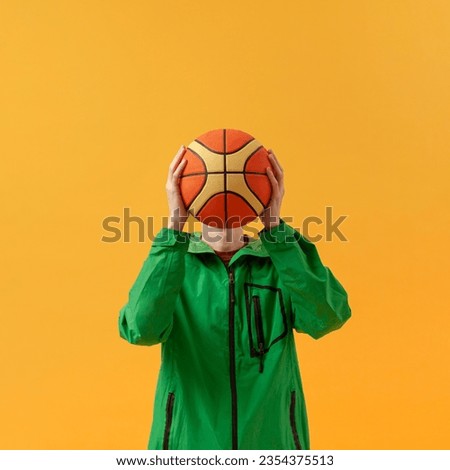 photo front view boy playing with basketball ball