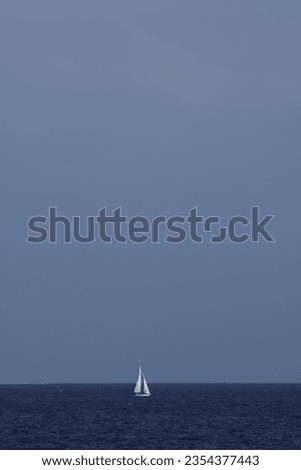 Sail Boat in Open Water IN Front of Horizon Calming Photo