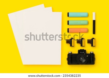 Things on my desk flat lay, photography concept, magazine cover mockup.  Back to school flat lay on yelow background.