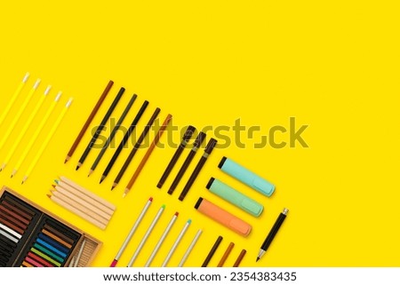 Drawing instruments, stationary flat lay. Back to school flat lays on yellow background.