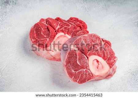 Raw Osso buco Veal shank steak, meat Ossobuco. White background. Top view. Copy space. Royalty-Free Stock Photo #2354415463
