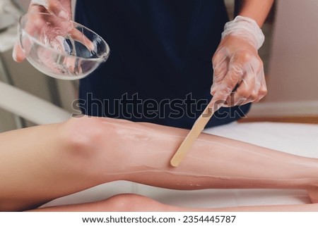 Beautician Giving Epilation Laser Treatment To Woman On Thigh Royalty-Free Stock Photo #2354445787