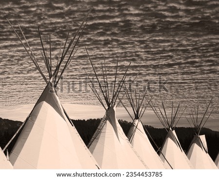 Traditional indigenous home in sepia tones; teepee symbolizes native culture. No people.