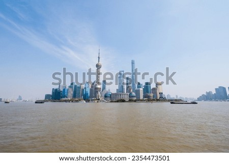 Dynamic Shanghai skyline by the sea showcases stunning architecture and city views.