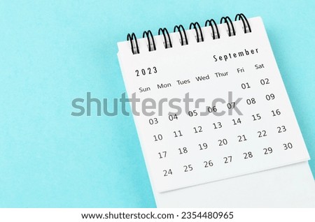 September 2023 Monthly desk calendar for 2023 year on blue background. Royalty-Free Stock Photo #2354480965