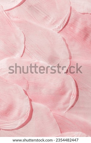 Nature pattern of dry petals, transparent leaves with natural texture as natural background or wallpaper. Macro texture, skeleton flower petal. Monochrome pink color aesthetic beauty of nature