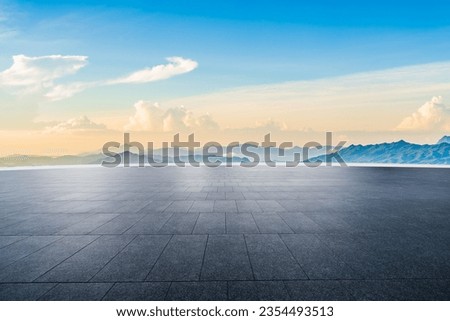 Empty square floor and mountain natural scenery at sunrise