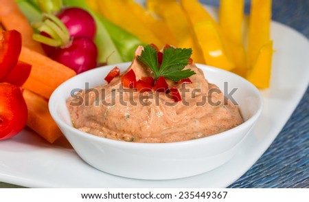 Vegetable sticks with herb and tomato dip. Royalty-Free Stock Photo #235449367