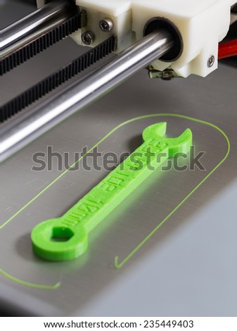 3d printing with light green filament. Royalty-Free Stock Photo #235449403