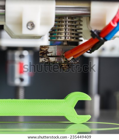 3d printing with light green filament. Royalty-Free Stock Photo #235449409