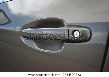 Green Car Door Handle with Key Lock on New Vehicle