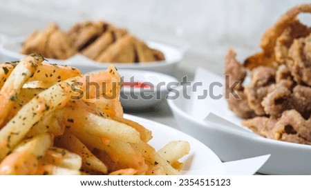 Ultimate Fried Delights Platter: Crispy Mushroom, Chicken Skin, Bakso Tahu, and French Fries with Dipping Sauces