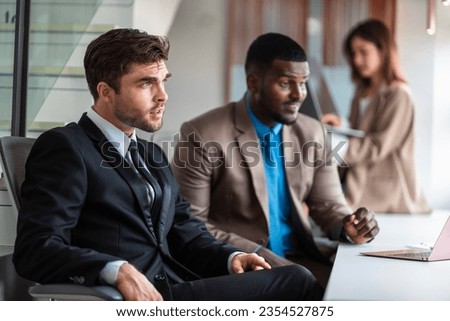 Male mature caucasian ceo businessman leader with diverse coworkers team executive managers group meeting. Multicultural professional businesspeople working together on research plan boardroom.