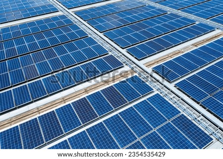 Solar panels background from aerial view on roof of department store.