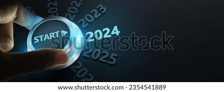 happy new year 2024,Finger about to twist the start button 2024 with the text 2023,2024,2025 and start on twist button.Concept of planning,start,career path,business strategy,opportunity and change Royalty-Free Stock Photo #2354541889