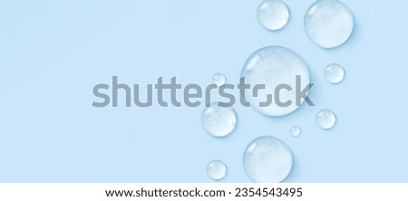 drop of serum gel cosmetic essence on a light pastel background Royalty-Free Stock Photo #2354543495