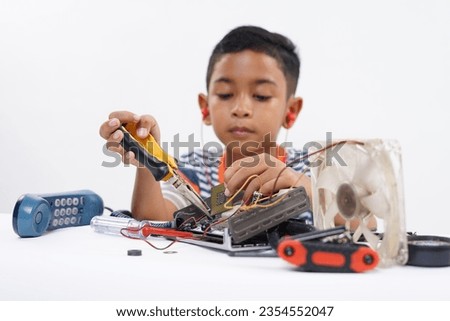 Little Boy holding Computer Processor to identify and fix motherboard problems