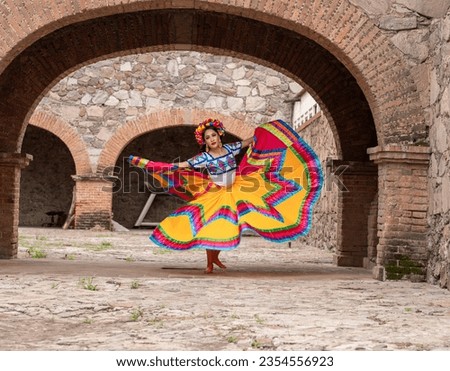 Pretty Young Woman Wearing traditional folkloric dress independence day or cinco de mayo parade or cultural Festival