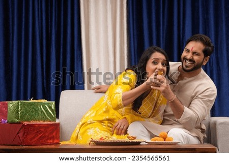 Young Indian Brother and sister celebrating Raksha Bandhan,BhaiDooj,Festival Royalty-Free Stock Photo #2354565561