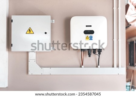 Electrical control cabinet of solar cell PV grid tile Inverter system. Installation for home user. Save electric bill with innovation technology. Royalty-Free Stock Photo #2354587045