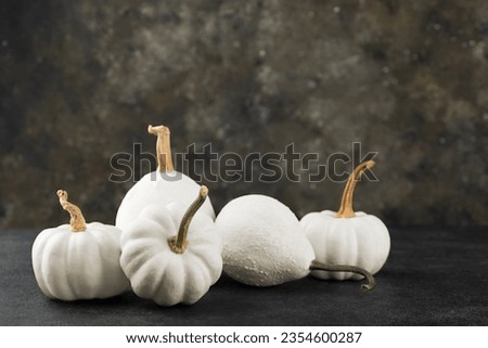 Happy Halloween with spooky and white pumpkin .