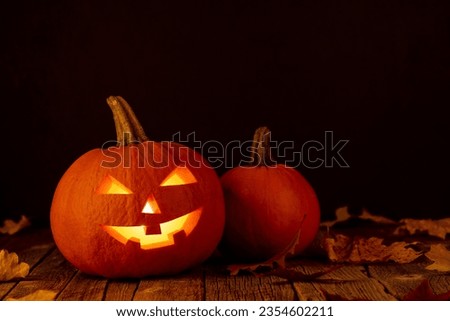 Halloween pumpkins on wooden table with copy space