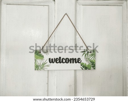 door sign welcome white color