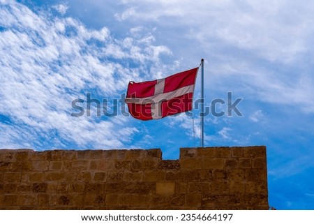 Red rectangular flag with the white latin cross. The State flag of the Sovereign Order of Malta. 