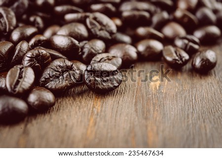 Coffee beans on wooden background - vintage effect style pictures