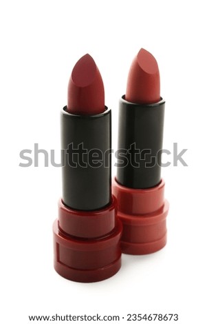 Beautiful red lipsticks in different shades on white background