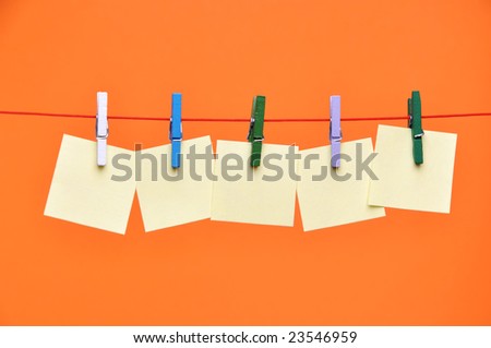 paper Blanks Hanging on a Rope Held By Clothespins