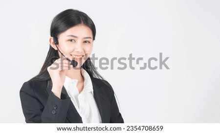 business customer support operator woman smiling speak with headphone on white background , Beautiful Asian woman officer talk with customer 