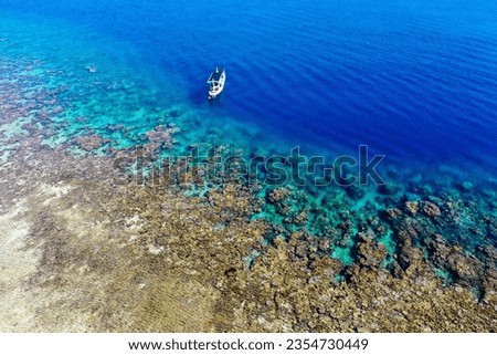 beautiful underwater waterfall Aerial view Blue sea and white rocks Background image of the sea island. Deep sea and corals. Top view of beautiful Sea. Aerial drone shot of turquoise water