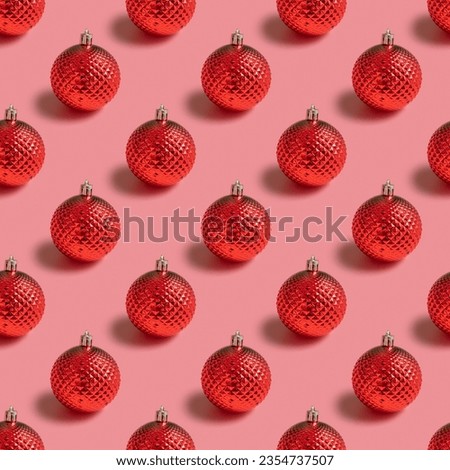 Seamless pattern with Christmas bauble on pink background.