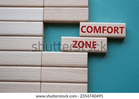 Comfort zone symbol. Concept word Comfort zone on wooden blocks. Beautiful grey green background. Business and Comfort zone concept. Copy space Royalty-Free Stock Photo #2354740495