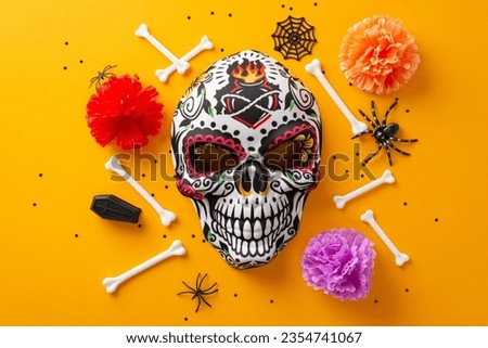 Carnival mask showcasing a flowery skeleton design with creepy elements like spiders, bones, cobwebs, small coffin and confetti. Top view on orange background, ideal for promotional content