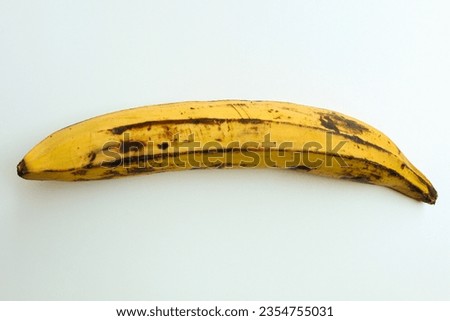 One banana. Long ripe yellow banana. Isolated on white background Royalty-Free Stock Photo #2354755031