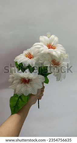 Flowers, artificial flowers, flowers in hand stock images. 